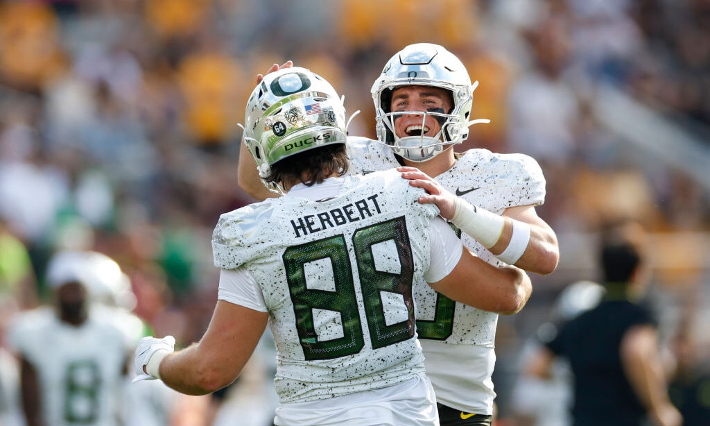 TEMPE, ARIZONA - NOVEMBER 18: Bo Nix #10 of the Oregon Ducks celebrates after throwing a touchdown ...
