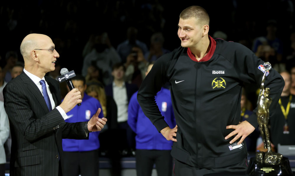 NBA Commissioner Adam Silver presents Nikola Jokic #15 of the Denver Nuggets with the Michael Jorda...