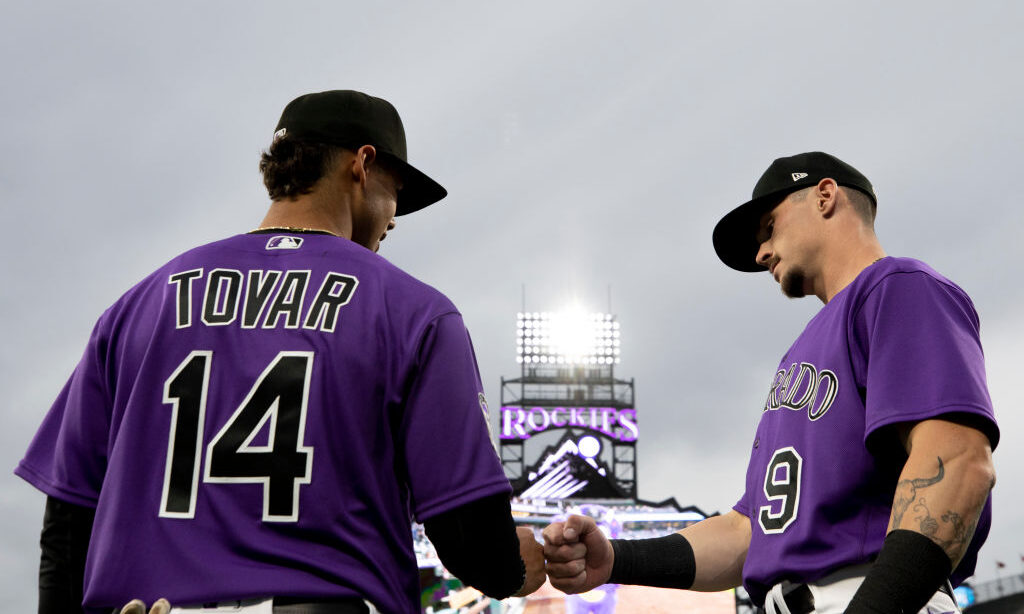 DENVER, CO - MAY 2: Ezequiel Tovar #14 of the Colorado Rockies and Brenton Doyle #9 of the Colorado...