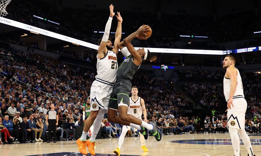 Jaden McDaniels #3 of the Minnesota Timberwolves goes up for a shot against Jamal Murray #27 of the...