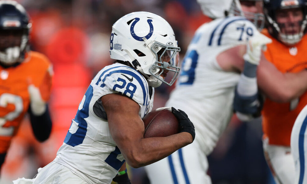 Jonathan Taylor #28 of the Indianapolis Colts carries the ball against the Denver Broncos...