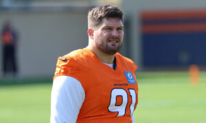 Broncos DL Matt Henningsen leaves training camp on a cart