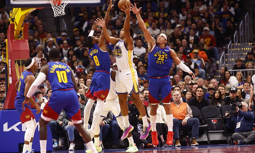 DENVER, COLORADO - NOVEMBER 7: Trayce Jackson-Davis #32 of the Golden State Warriors goes to the ba...