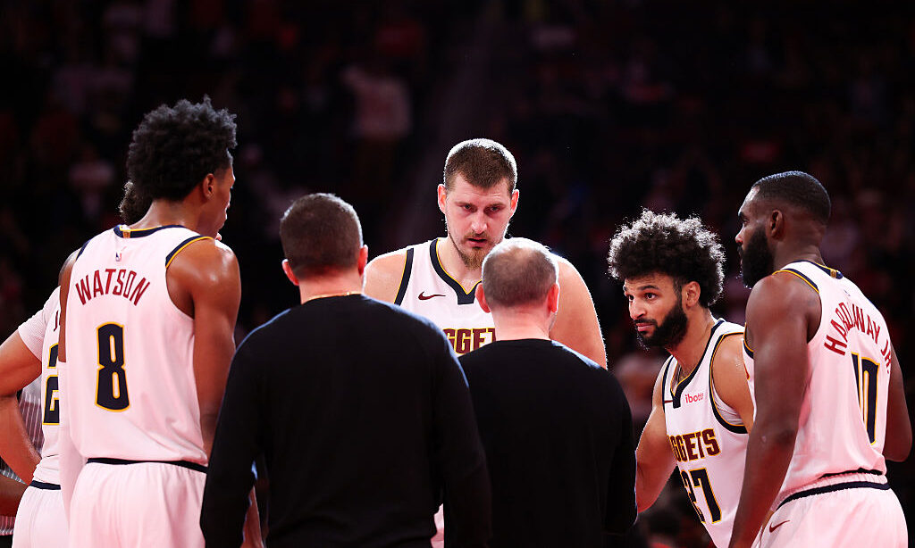 HOUSTON, TEXAS - NOVEMBER 21: The Denver Nuggets speak with Head coach David Adelman of the Denver ...