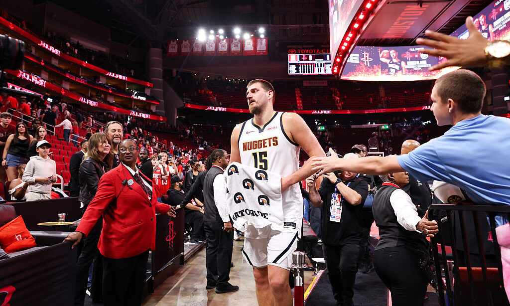 HOUSTON, TEXAS - NOVEMBER 21: Nikola Jokić #15 of the Denver Nuggets walks off the court following...