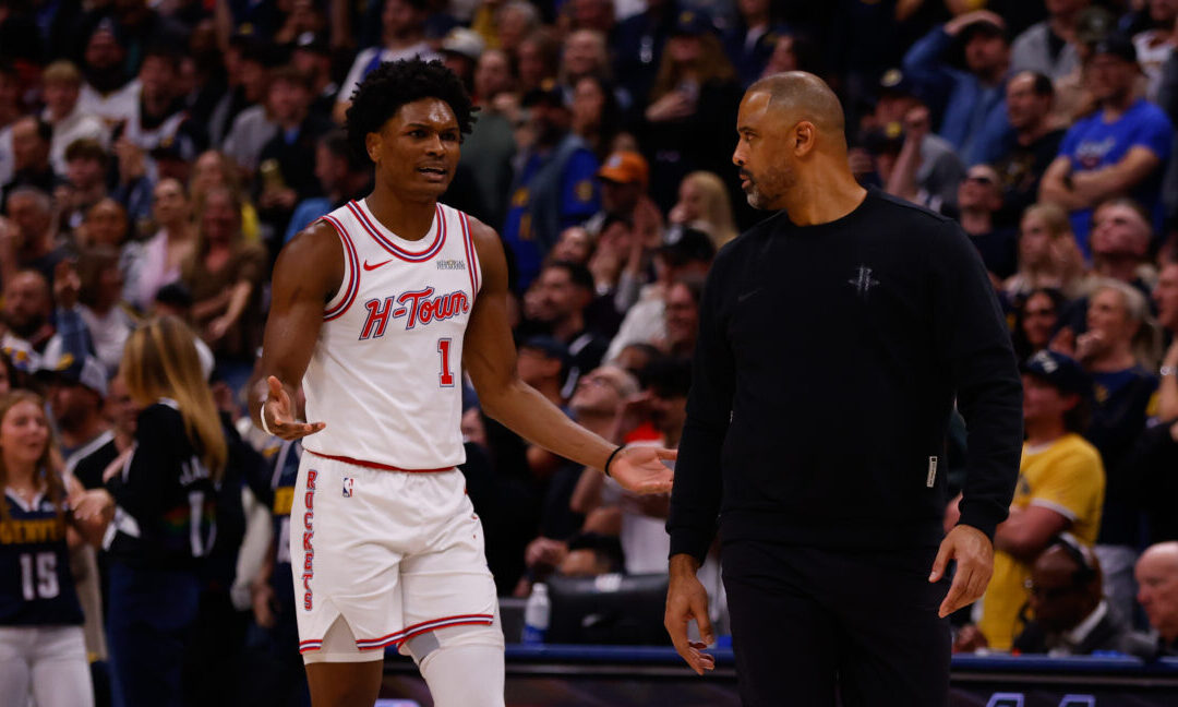 DENVER, CO - DECEMBER 15: Amen Thompson #1 of the Houston Rockets reacts as he looks at Ime Udoka o...