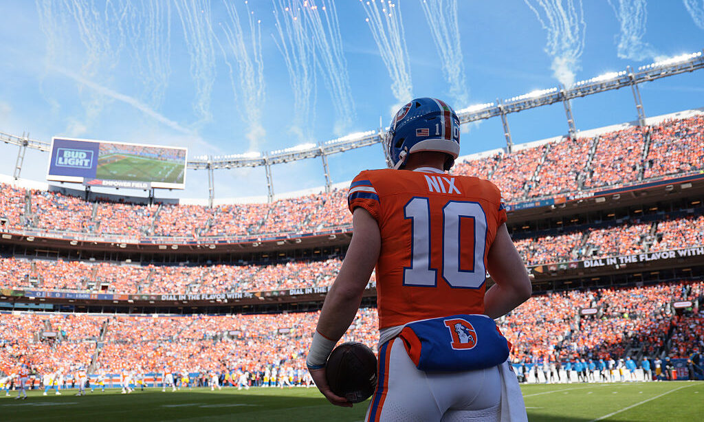DENVER, COLORADO - JANUARY 04: Bo Nix #10 of the Denver Broncos looks on before the game against th...