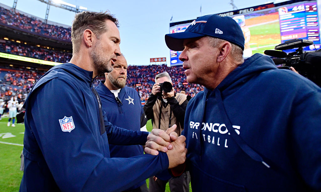 DENVER, COLORADO - OCTOBER 26: Head coach Brian Schottenheimer of the Dallas Cowboys and head coach...