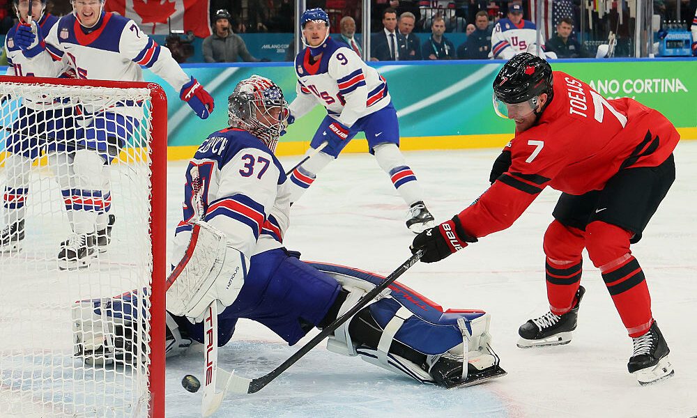 MILAN, ITALY - FEBRUARY 22: Connor Hellebuyck #37 of Team United States makes a save against Devon ...