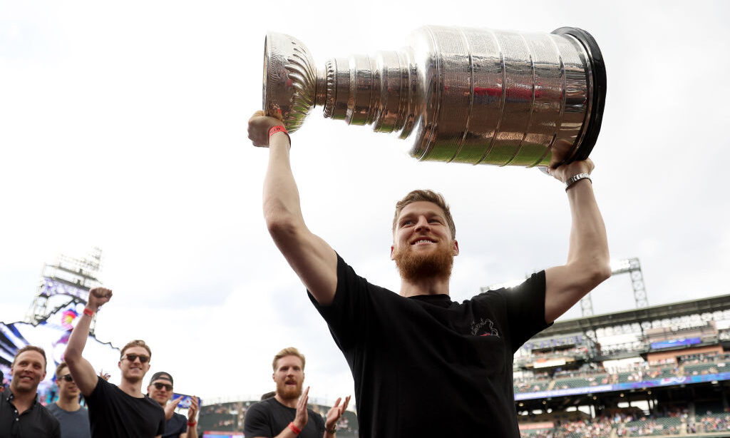 DENVER, COLORADO - JUNE 29: Nathan MacKinnon of the Colorado Avalanche lifts the Stanley Cup after ...