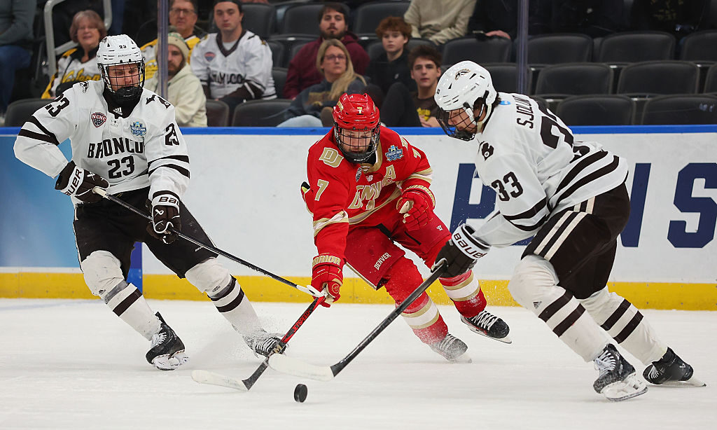 ST LOUIS, MISSOURI - APRIL 10: Aidan Thompson #7 of the University of Denver Pioneers looks to beat...