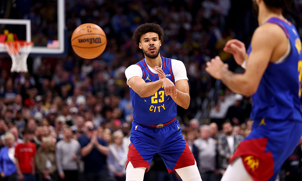 DENVER, COLORADO - MARCH 1: Cameron Johnson #23 of the Denver Nuggets makes a pass against the Minn...