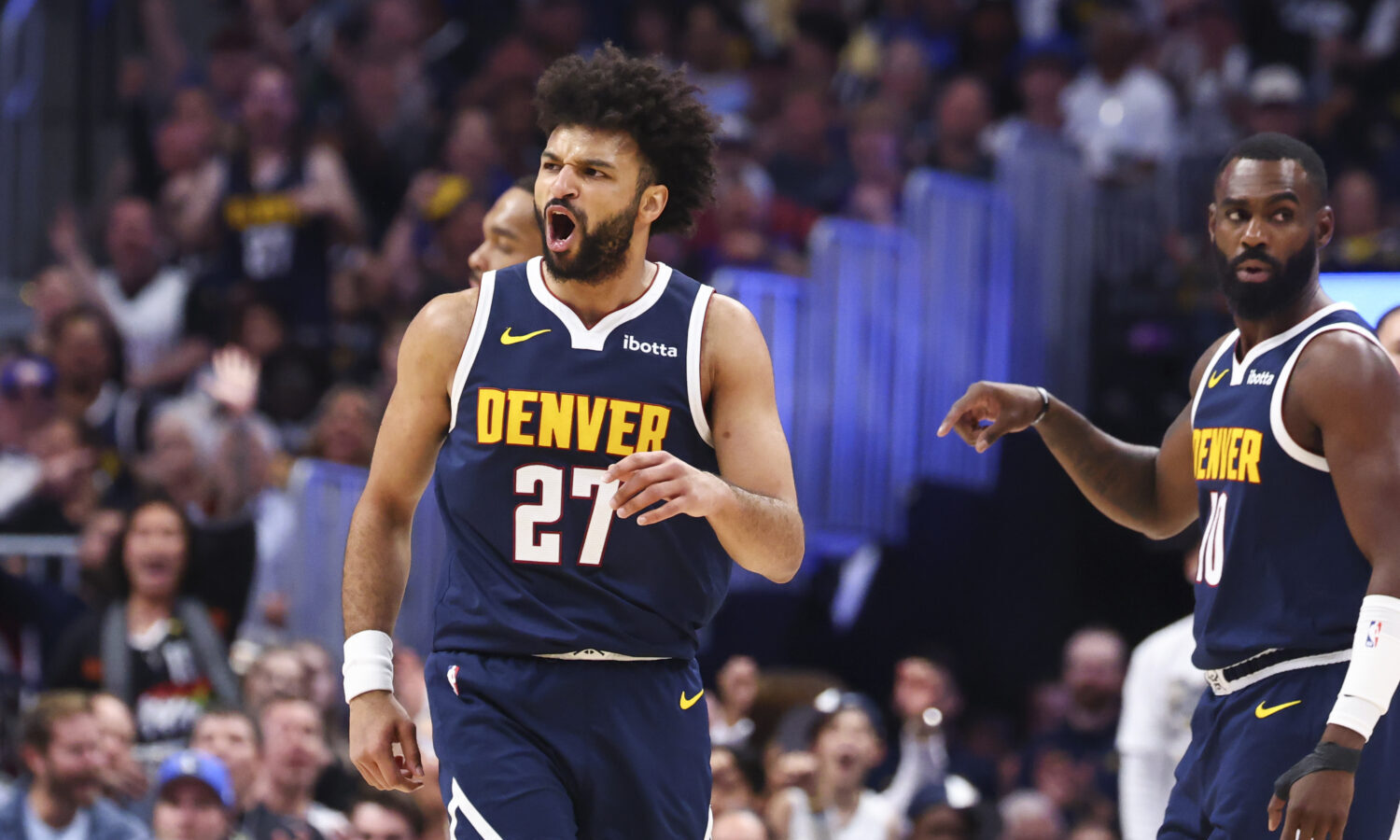 DENVER, COLORADO - MARCH 25: Jamal Murray #27 of the Denver Nuggets reacts after a basket against t...