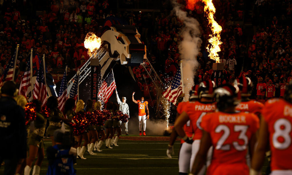 DENVER, CO - NOVEMBER 12: Cornerback Aqib Talib #21 of the Denver Broncos walks onto the field next...