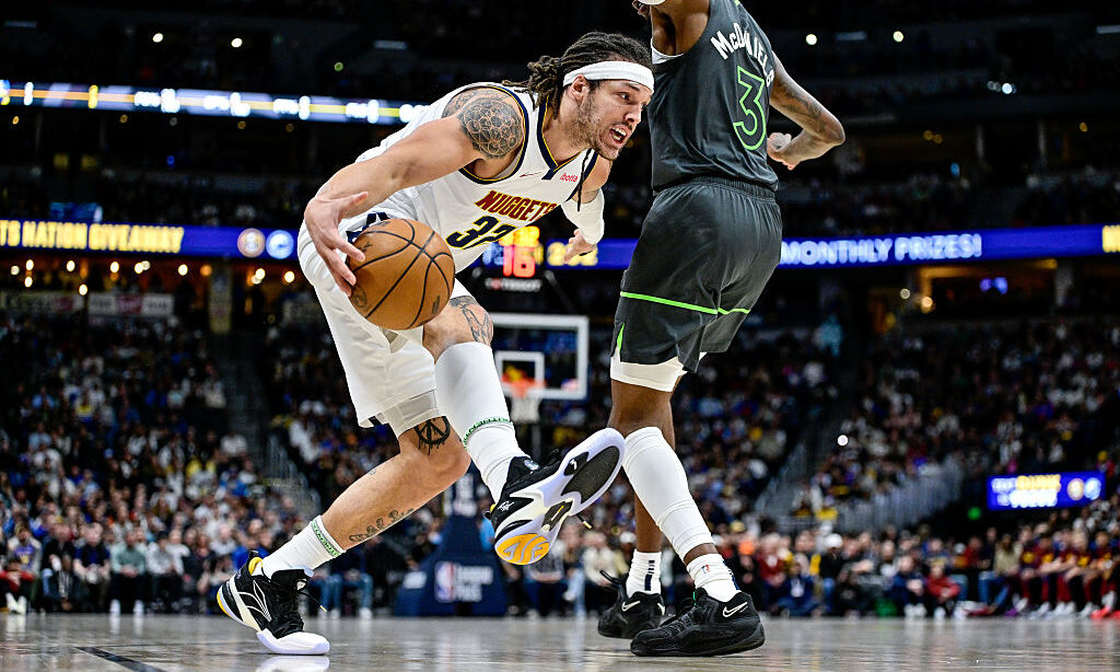DENVER, COLORADO - APRIL 1: Aaron Gordon #32 of the Denver Nuggets drives to the basket against Jad...