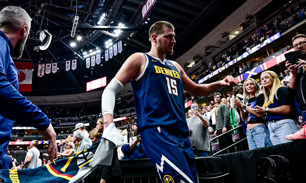 DENVER, COLORADO - APRIL 6: Nikola Jokic #15 of the Denver Nuggets celebrates after the win against...