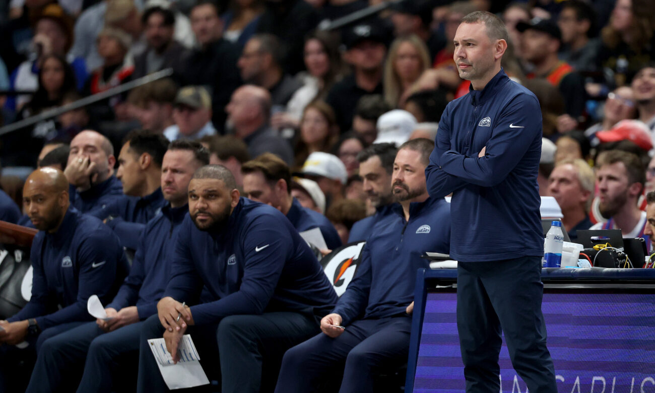 DENVER, COLORADO - APRIL 10: Head coach David Adelman of the Denver Nuggets watches as his tam play...