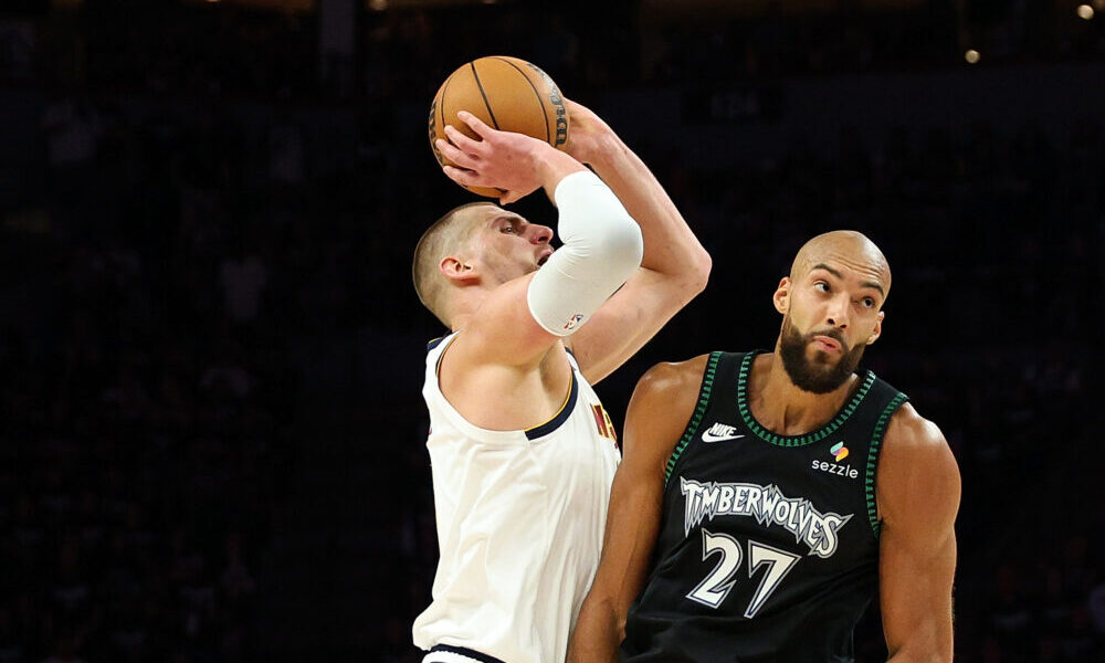 MINNEAPOLIS, MINNESOTA - APRIL 23: Nikola Jokic #15 of the Denver Nuggets draws a foul against Rudy...