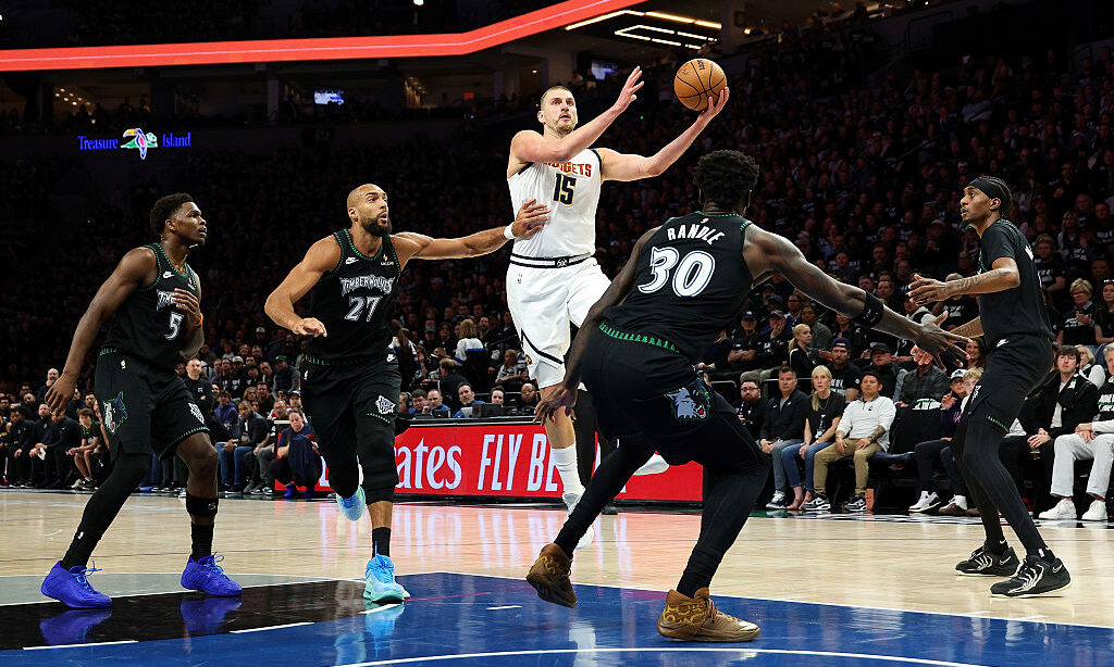 MINNEAPOLIS, MINNESOTA - APRIL 25: Nikola Jokic #15 of the Denver Nuggets goes up for a shot agains...