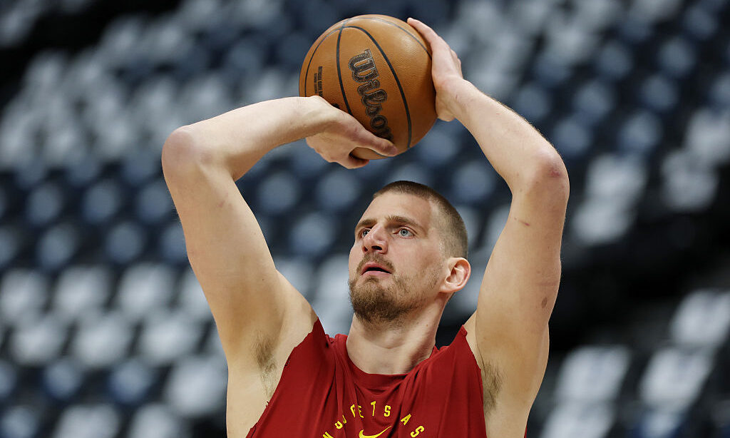 DENVER, COLORADO - APRIL 27: Nikola Jokic #15 of the Denver Nuggets warms up before Game Five of th...