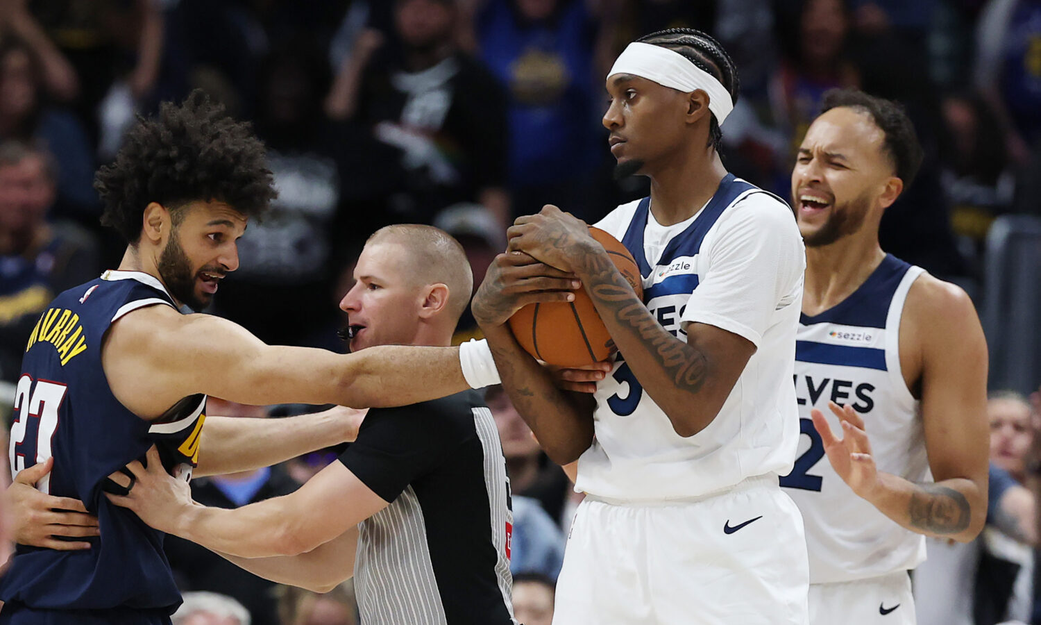DENVER, COLORADO - APRIL 27: Jaden McDaniels #3 of the Minnesota Timberwolves collects a loose ball...