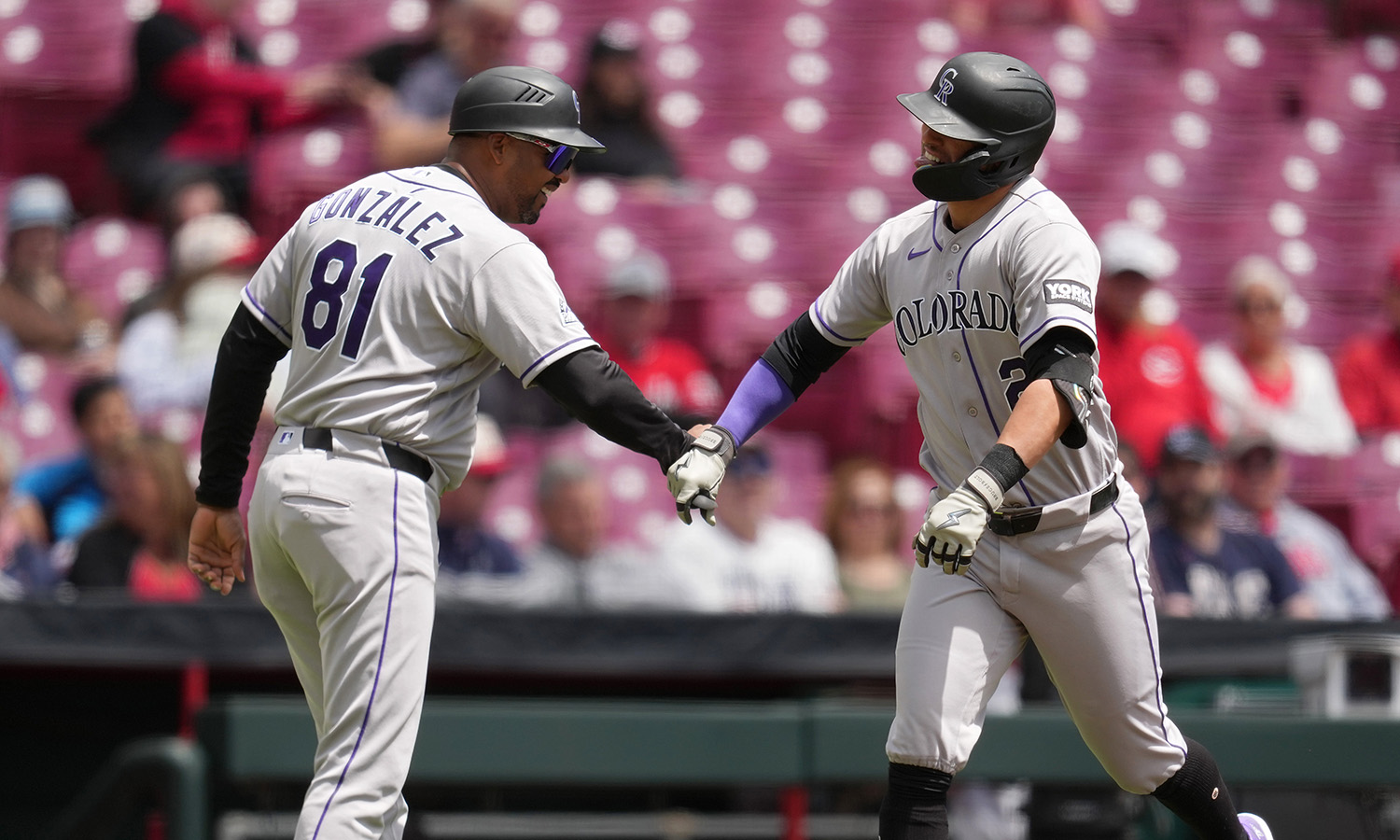Rockies DH Tyler Freeman rounds third after his first home run of the season...