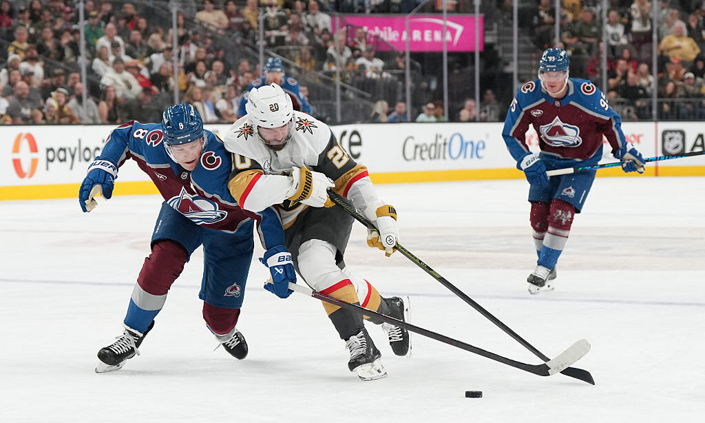 LAS VEGAS, NEVADA - OCTOBER 31: Cale Makar #8 of the Colorado Avalanche pushes Brandon Saad #20 of ...