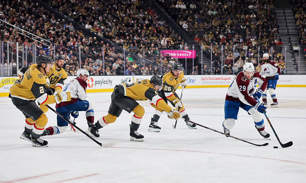 LAS VEGAS, NEVADA - DECEMBER 27: Nathan MacKinnon #29 of the Colorado Avalanche gains control of a ...