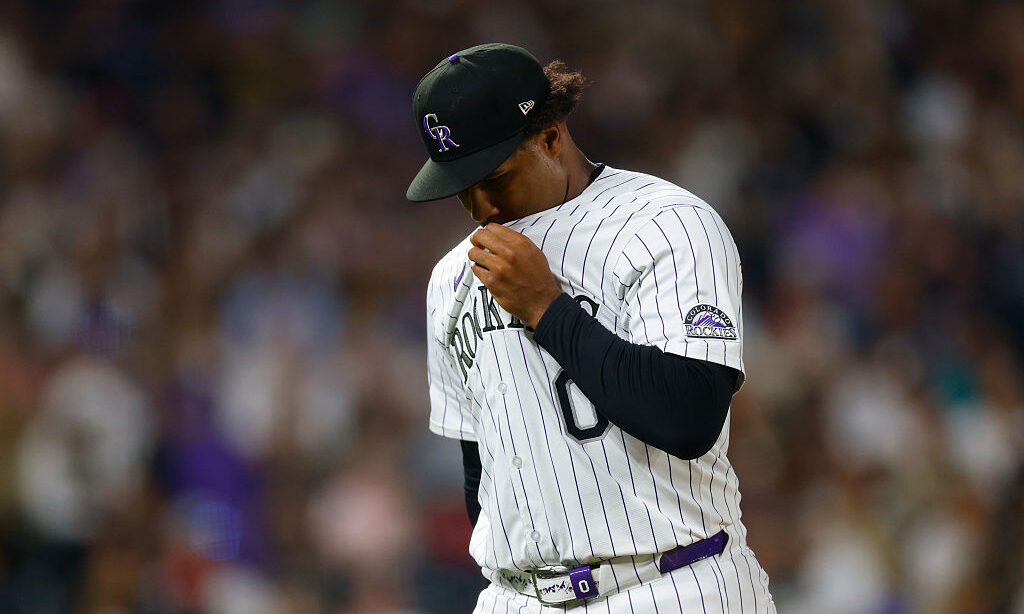 DENVER, CO - SEPTEMBER 6: Jaden Hill #0 of the Colorado Rockies uses his jersey to wipe his face as...