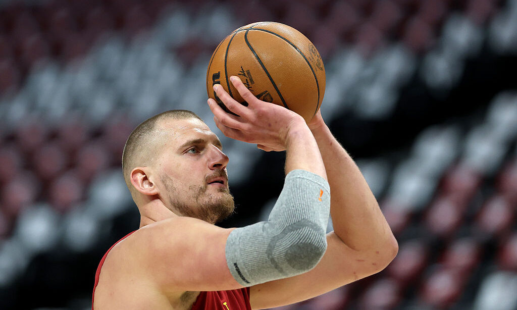 DENVER, COLORADO - APRIL 18: Nikola Jokic #15 of the Denver Nuggets warms up prior to playing the M...
