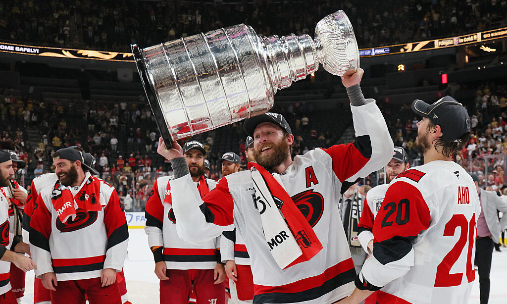 LAS VEGAS, NEVADA - JUNE 14: Jaccob Slavin #74 of the Carolina Hurricanes holds the Stanley Cup Tro...