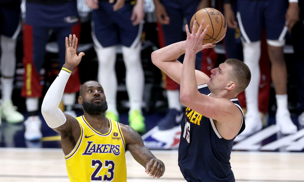 DENVER, COLORADO - APRIL 29: Nikola Jokic #15 of the Denver Nuggets puts up a shot against LeBron J...