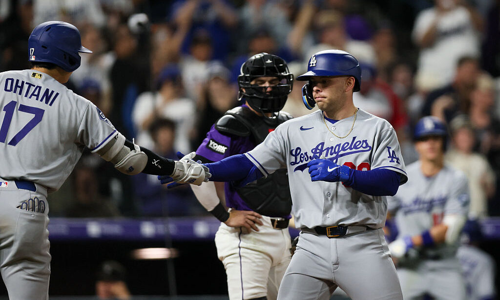 DENVER, CO - APRIL 20: Dalton Rushing #68 of the Los Angeles Dodgers is congratulated by Shohei Oht...