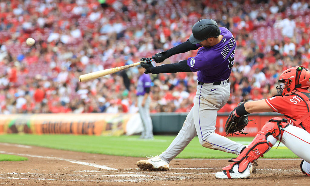 CINCINNATI, OHIO - APRIL 28: Edouard Julien #6 of the Colorado Rockies hits a home run during the t...