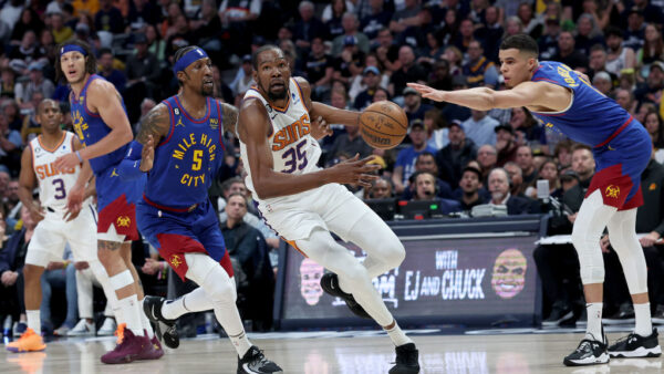 DENVER, COLORADO - APRIL 29: Kevin Durant #35 of the Phoenix Suns drives against Kentavious Caldwell-Pope #5 and Michael Porter Jr. #1 of the Denver Nuggets in the third quarter at Ball Arena on April 29, 2023 in Denver, Colorado. NOTE TO USER: User expressly acknowledges and agrees that, by downloading and/or using this photograph, User is consenting to the terms and conditions of the Getty Images License Agreement.