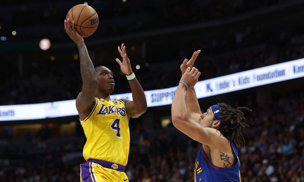 DENVER, COLORADO - MAY 16: Lonnie Walker IV #4 of the Los Angeles Lakers shoots the ball against Aaron Gordon #50 of the Denver Nuggets during the first quarter in game one of the Western Conference Finals at Ball Arena on May 16, 2023 in Denver, Colorado. NOTE TO USER: User expressly acknowledges and agrees that, by downloading and or using this photograph, User is consenting to the terms and conditions of the Getty Images License Agreement.