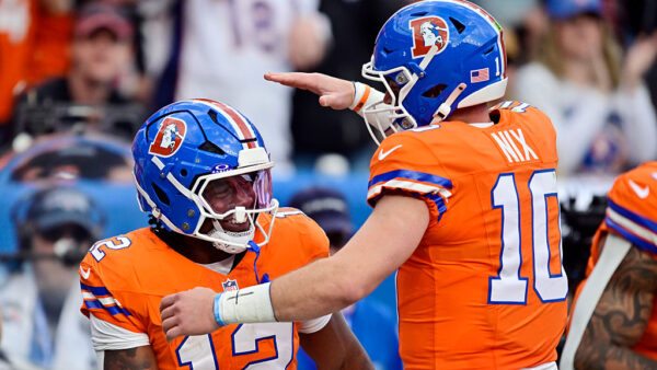 DENVER, COLORADO - OCTOBER 26: RJ Harvey #12 and Bo Nix #10 of the Denver Broncos celebrate after Harvey's rushing touchdown against the Dallas Cowboys during the fourth quarter in the game at Empower Field At Mile High on October 26, 2025 in Denver, Colorado.
