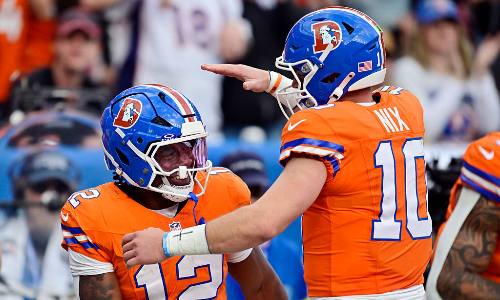 DENVER, COLORADO - OCTOBER 26: RJ Harvey #12 and Bo Nix #10 of the Denver Broncos celebrate after Harvey's rushing touchdown against the Dallas Cowboys during the fourth quarter in the game at Empower Field At Mile High on October 26, 2025 in Denver, Colorado.