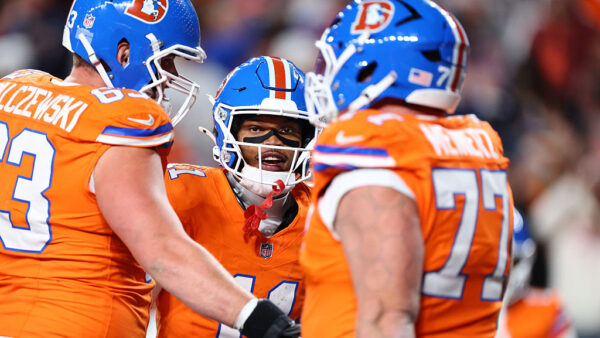 DENVER, COLORADO - NOVEMBER 06: Troy Franklin #11 of the Denver Broncos celebrates with Alex Palczewski #63 and Quinn Meinerz #77 after scoring a 7 yard touchdown against the Las Vegas Raiders during the second quarter in the game at Empower Field At Mile High on November 06, 2025 in Denver, Colorado.