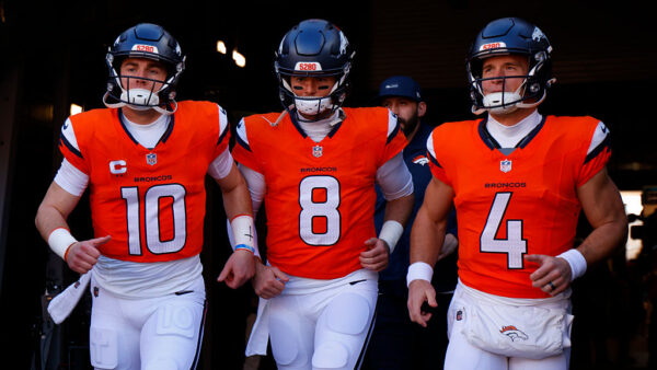 DENVER, COLORADO - JANUARY 17: Bo Nix #10, Jarrett Stidham #8 and Sam Ehlinger #4 of the Denver Broncos take the field prior to the AFC Divisional Playoff game against the Buffalo Bills at Empower Field At Mile High on January 17, 2026 in Denver, Colorado.
