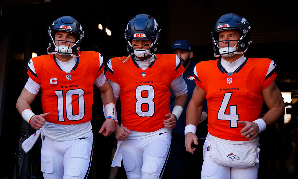 DENVER, COLORADO - JANUARY 17: Bo Nix #10, Jarrett Stidham #8 and Sam Ehlinger #4 of the Denver Broncos take the field prior to the AFC Divisional Playoff game against the Buffalo Bills at Empower Field At Mile High on January 17, 2026 in Denver, Colorado.
