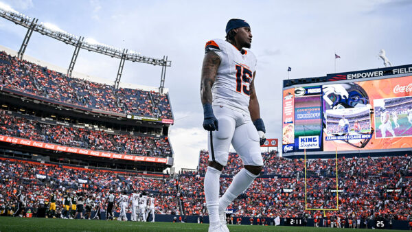 DENVER , CO - AUGUST 21: Nik Bonitto (15) of the Denver Broncos roams the field before the game against the Green Bay Packers at Empower Field at Mile High in Denver, Colorado on Friday, August 21, 2026.