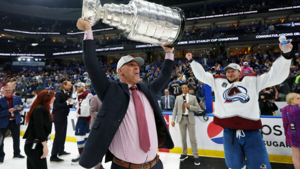 TAMPA, FLORIDA - JUNE 26: Head coach Jared Bednar of the Colorado Avalanche lifts the Stanley Cup after defeating the Tampa Bay Lightning 2-1 in Game Six of the 2022 NHL Stanley Cup Final at Amalie Arena on June 26, 2022 in Tampa, Florida.