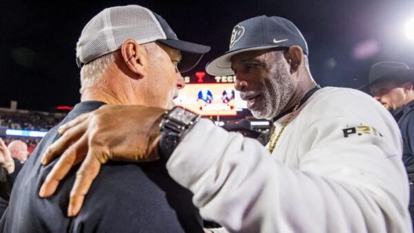 LUBBOCK, TEXAS - NOVEMBER 09: Head coach Joey McGuire of the Texas Tech Red Raiders and head coach Deion Sanders of the Colorado Buffaloes embrace after the game against the Colorado Buffaloes at Jones AT&T Stadium on November 09, 2024 in Lubbock, Texas.