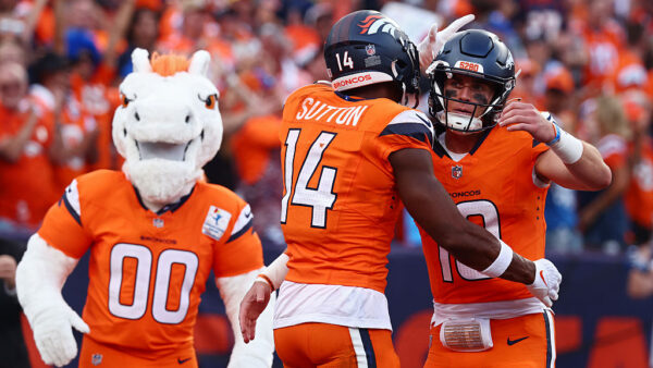 DENVER, COLORADO - SEPTEMBER 07: Bo Nix #10 of the Denver Broncos celebrates a touchdown with Courtland Sutton #14 of the Denver Broncos during the second quarter against the Tennessee Titans during the game at Empower Field At Mile High on September 07, 2025 in Denver, Colorado.