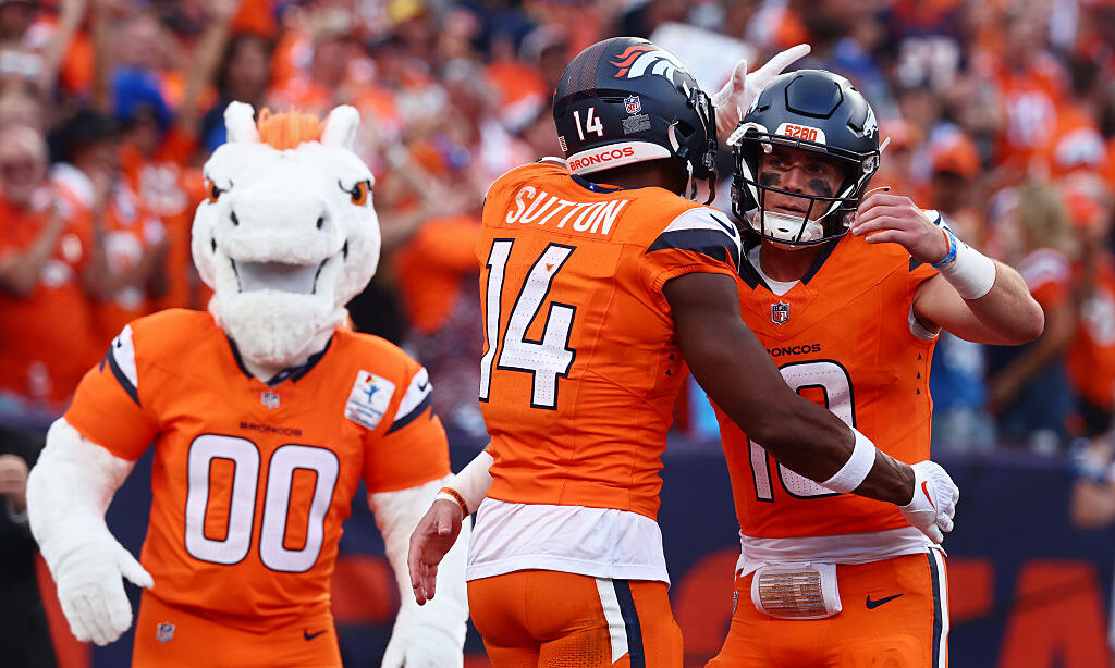 DENVER, COLORADO - SEPTEMBER 07: Bo Nix #10 of the Denver Broncos celebrates a touchdown with Courtland Sutton #14 of the Denver Broncos during the second quarter against the Tennessee Titans during the game at Empower Field At Mile High on September 07, 2025 in Denver, Colorado.