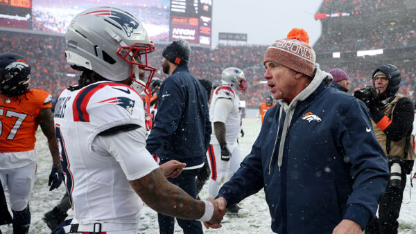 DENVER, COLORADO - JANUARY 25: Head coach Sean Payton of the Denver Broncos and DeMario Douglas #3 of the New England Patriots shake hands following the AFC Championship Playoff game at Empower Field At Mile High on January 25, 2026 in Denver, Colorado. The New England Patriots defeat the Denver Broncos 10-7.