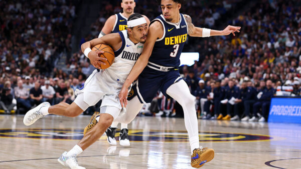 DENVER, COLORADO - MARCH 25: Ryan Nembhard #9 of the Dallas Mavericks drives to the basket against Julian Strawther #3 of the Denver Nuggets in the second quarter at Ball Arena on March 25, 2026 in Denver, Colorado. NOTE TO USER: User expressly acknowledges and agrees that, by downloading and or using this photograph, User is consenting to the terms and conditions of the Getty Images License Agreement.