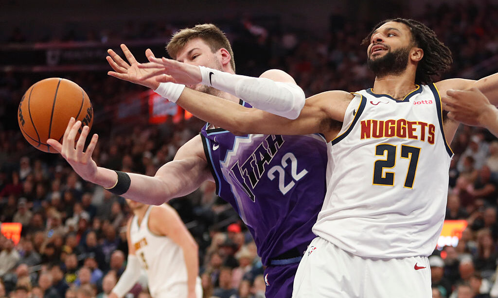 SALT LAKE CITY, UT - APRIL 1: Kyle Filipowski #22 of the Utah Jazz fights for a rebound with Jamal ...