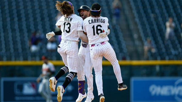 DENVER, CO - SEPTEMBER 2: Brett Sullivan #26 of the Colorado Rockies celebrates his walk-off, two-run single with Zac Veen #13 and Cole Carrigg #16 to for a 6-5 win in 11 innings against the Baltimore Orioles at Coors Field on September 2, 2026 in Denver, Colorado.